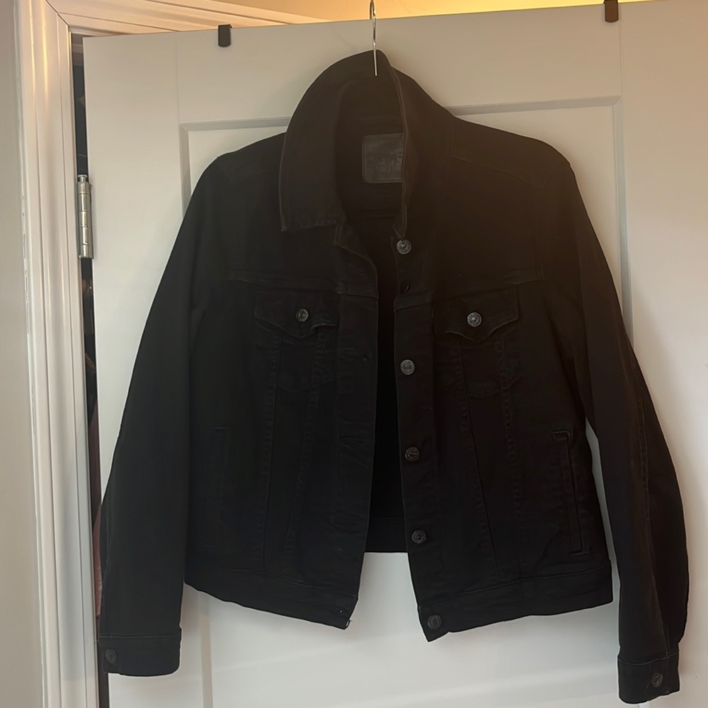 Levi’s black jean jacket in excellent condition.